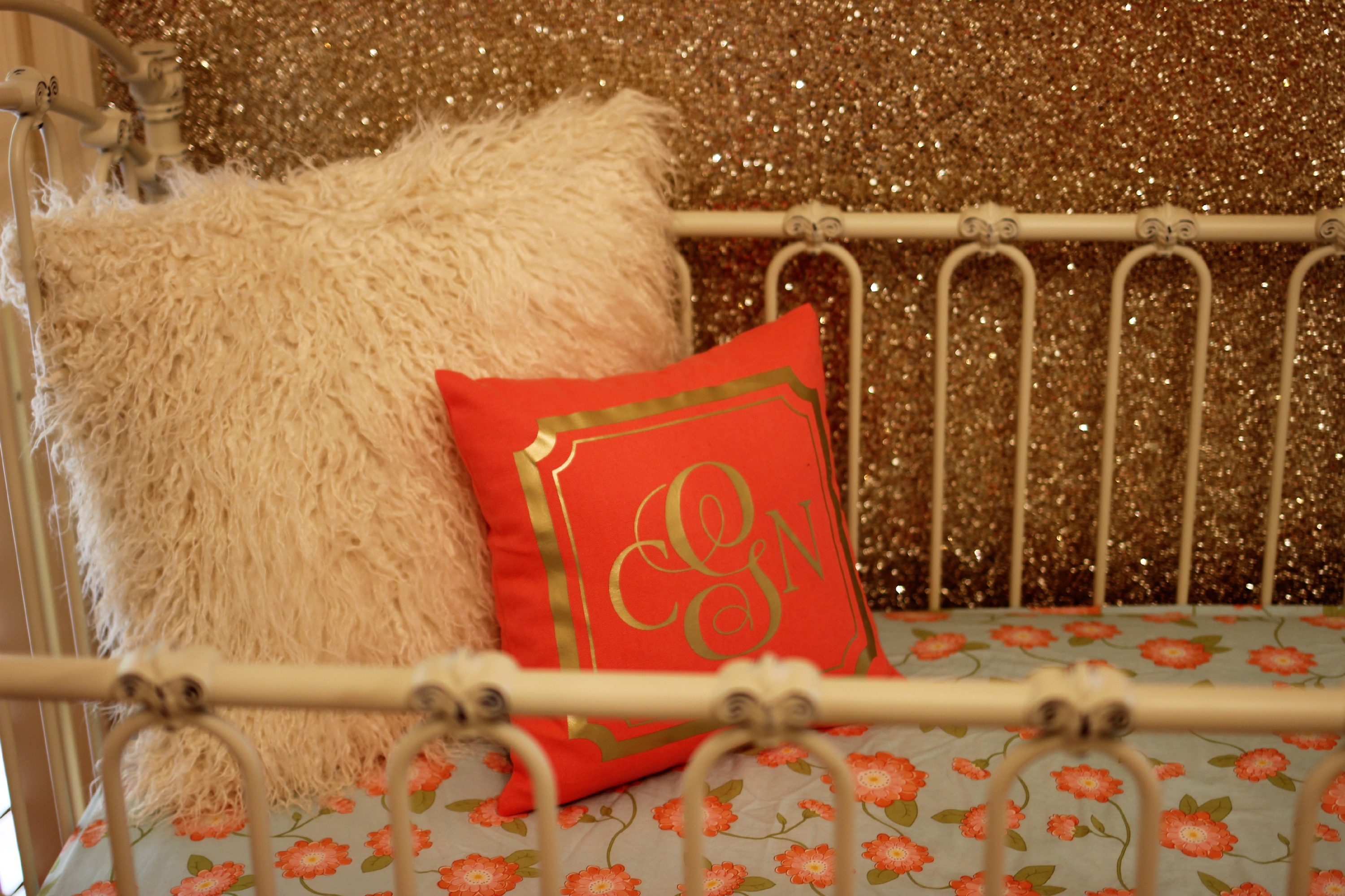 Coral and Gold Monogram Pillow in this Coral and Gold Nursery