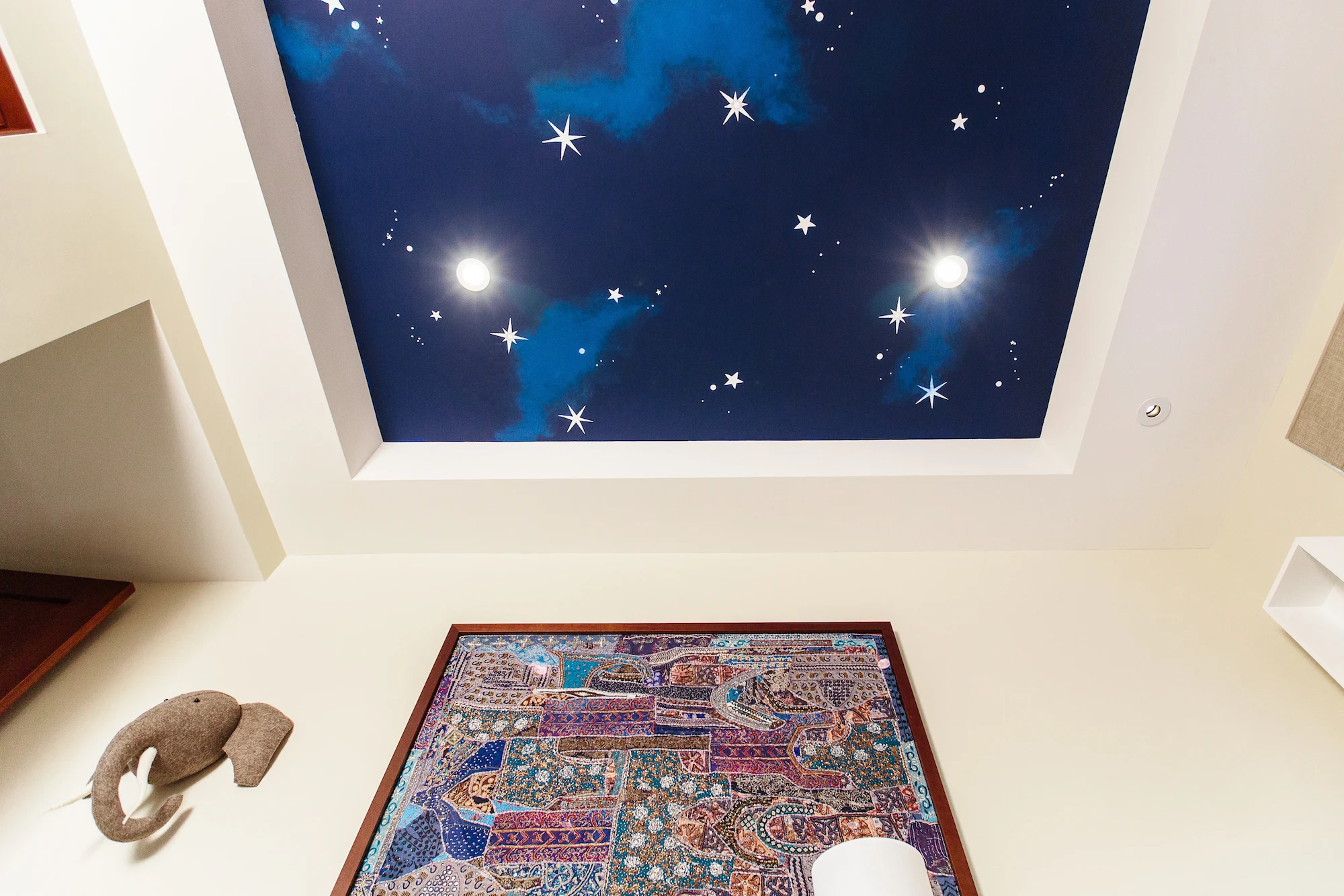 Animal-Inspired Nursery with Starry Sky Mural